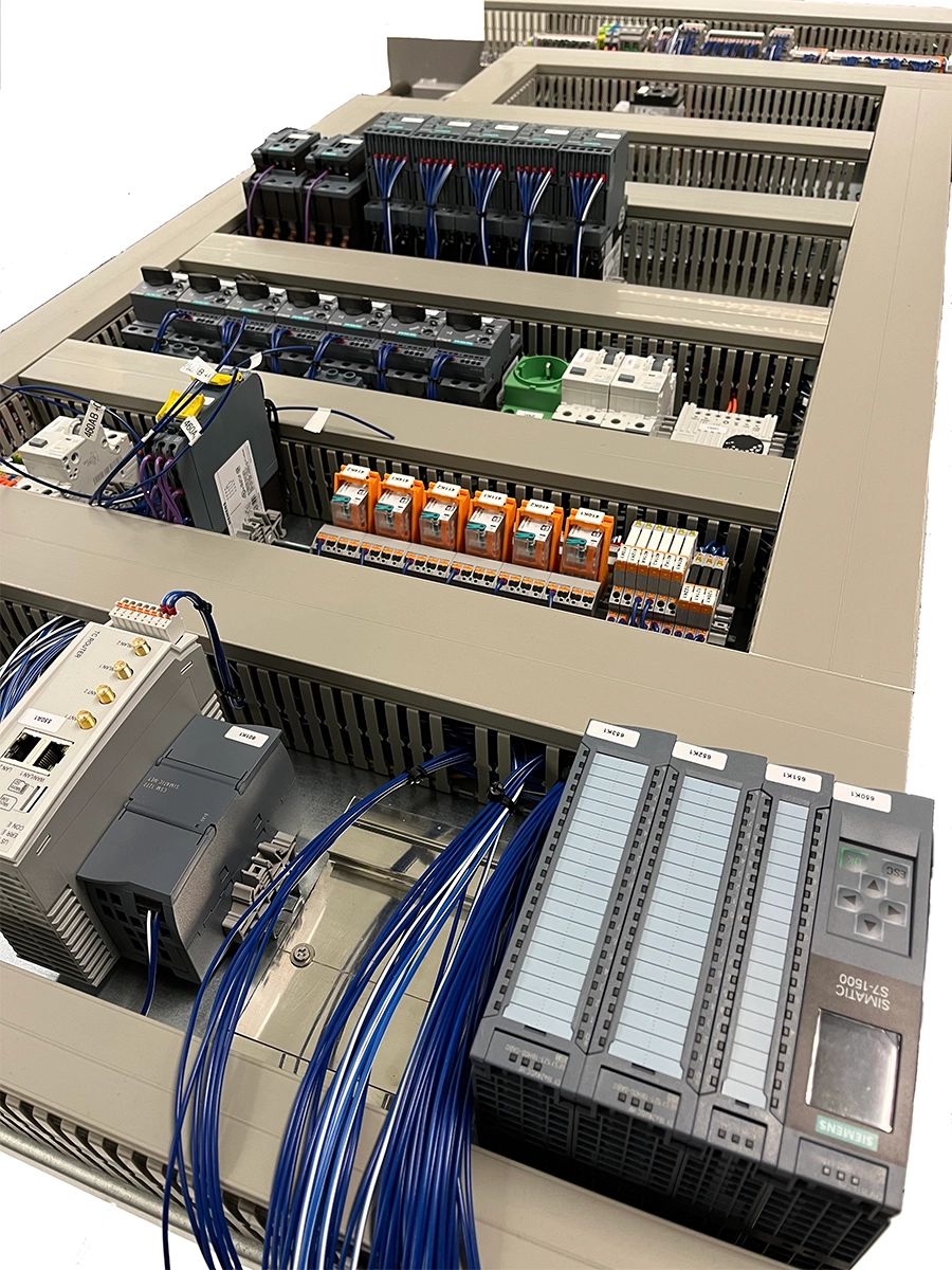 Control cabinet with Siemens PLC modules during wiring